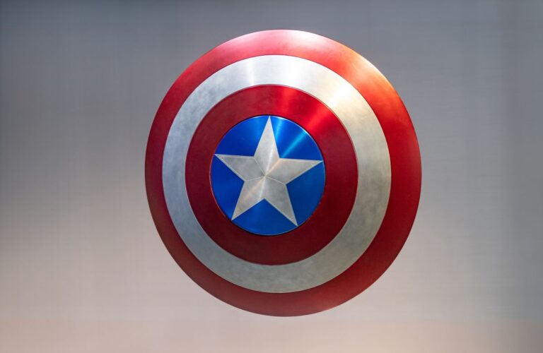 CaptainAmericasFamousShield-3dIllustration10Jun2023 3D illustration of a red, white, and blue circular shield with a central silver star, inspired by a famous superhero emblem. The metallic surface and bold colors symbolize protection, defense, and security concepts.
