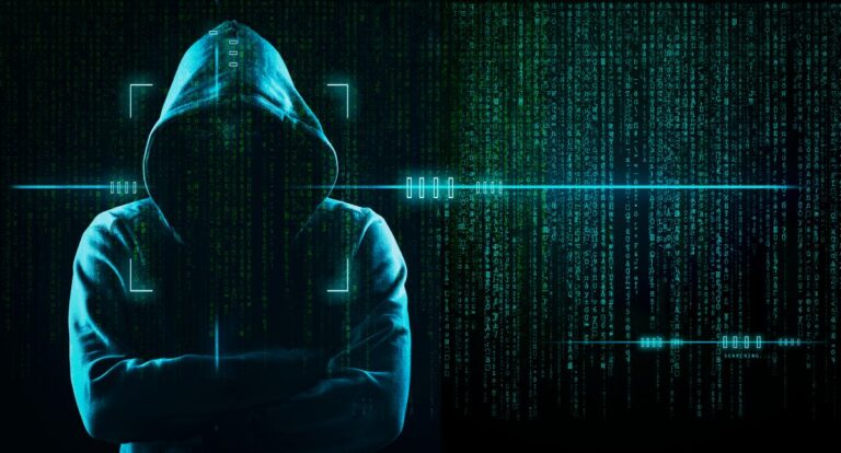 Silhouetted hooded figure standing against a dark digital background filled with cascading green code and scanning interface graphics. The image represents the dark web, cybercrime activity, and anonymous online threats in a high tech environment.