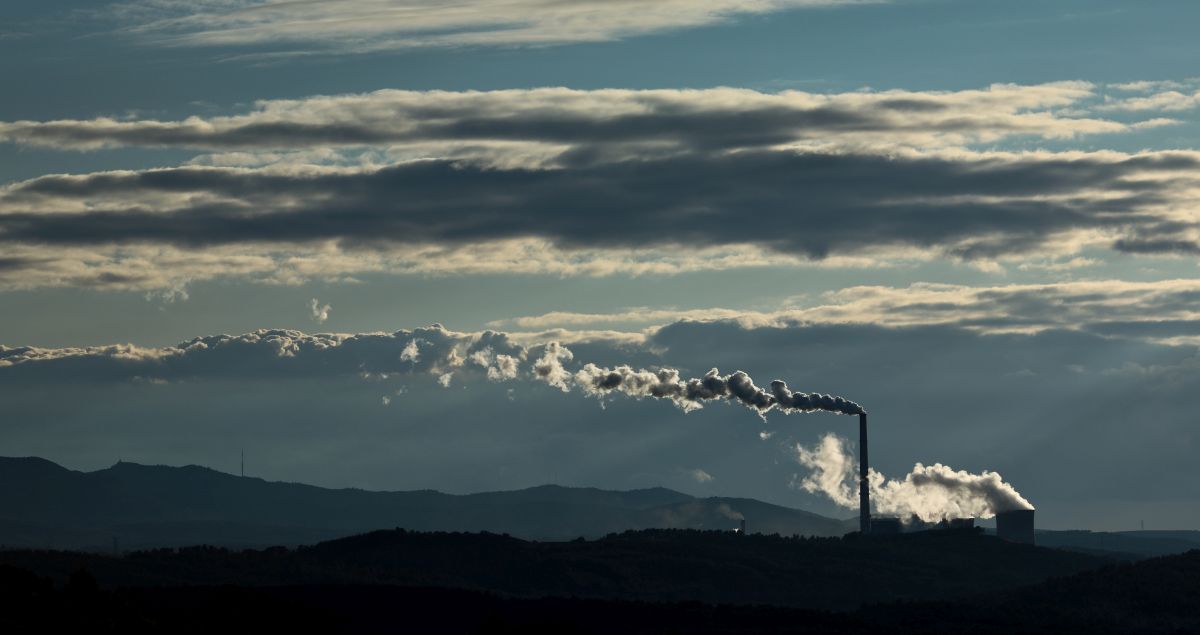 Factory polluting the environment color toned image