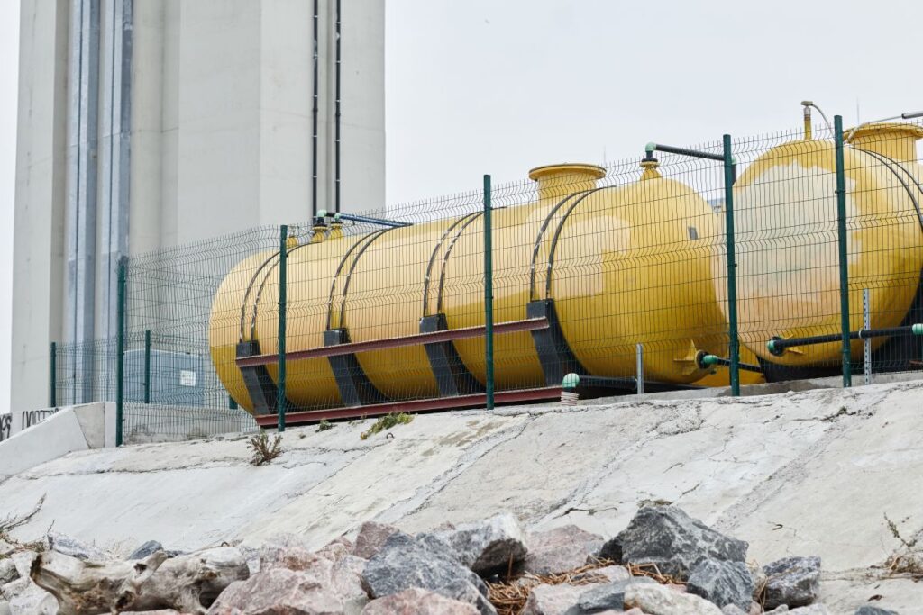Industrial Site Background A picture of Energy plant with yellow tanks for Regulatory recommendations