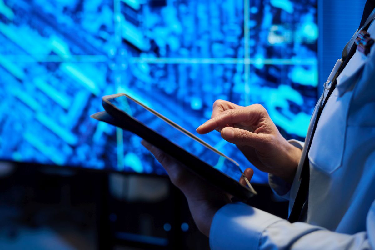 Officer in uniform pointing at screen