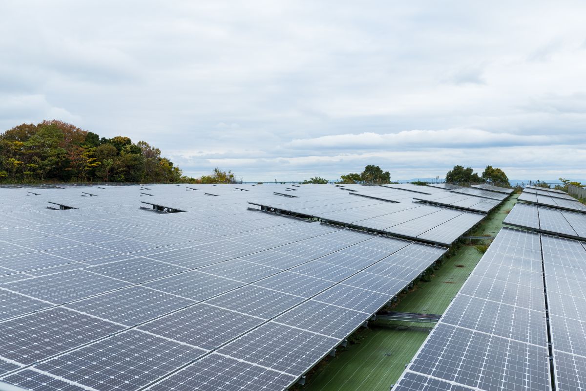 Solar panel Rows of solar panels installed at a solar power plant under a cloudy sky. The image highlights photovoltaic infrastructure generating renewable energy at utility scale.