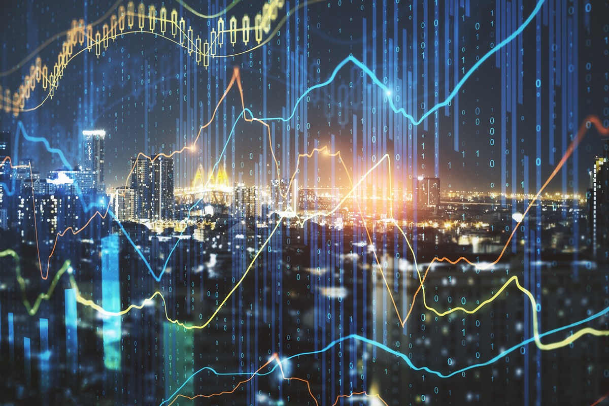 Stylized city skyline at night overlaid with glowing financial graphs, line charts, and binary code representing data and analytics. The image conveys rising infrastructure costs and financial risk in the utilities sector.