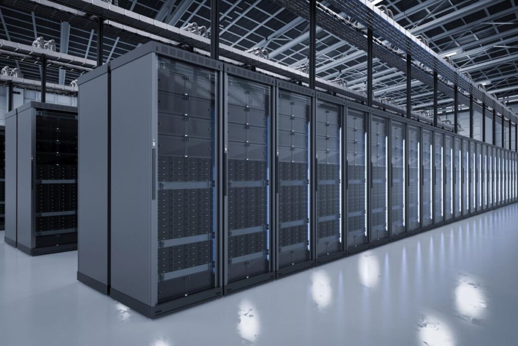 Modern data center with rows of black server racks in a bright, clean facility, showcasing large scale data storage infrastructure.