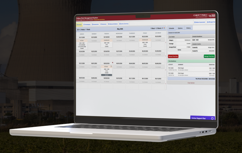 Laptop screen displaying a Fatigue Rule Management System calendar/dashboard on a desktop-like UI outside a building background (screenshot of the application).